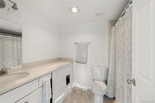 full bathroom featuring visible vents, toilet, and vanity