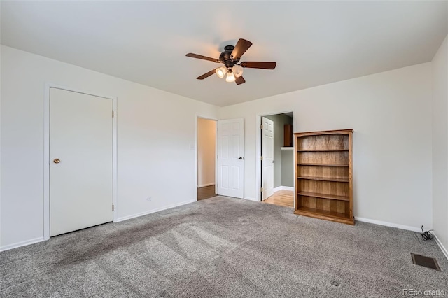 12189 Boot Hill Dr, Parker, CO 80138 - unfurnished bedroom featuring carpet floors, baseboards, and ceiling fan