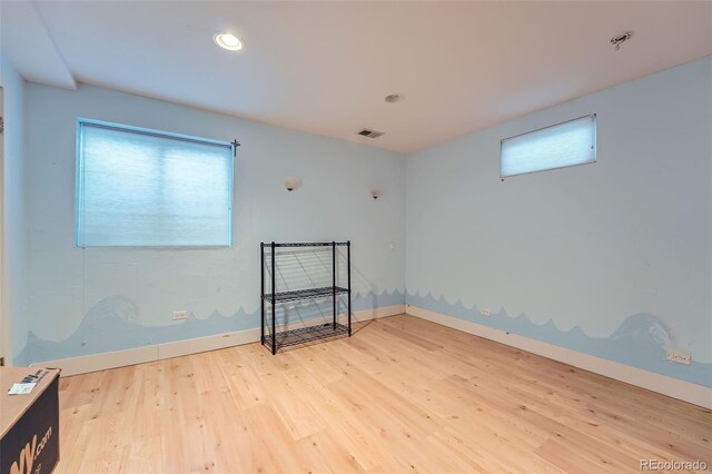 12189 Boot Hill Dr, Parker, CO 80138 - unfurnished room with wood finished floors, baseboards, a pendent fire sprinkler, and recessed lighting