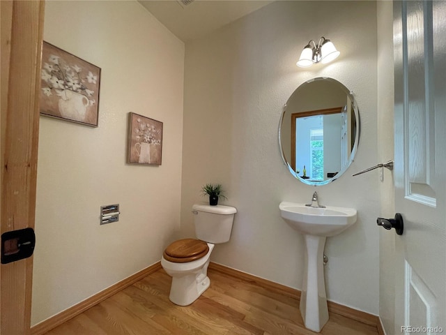 588 Stafford Cir, Castle Rock, CO 80104 - bathroom with toilet and wood finished floors