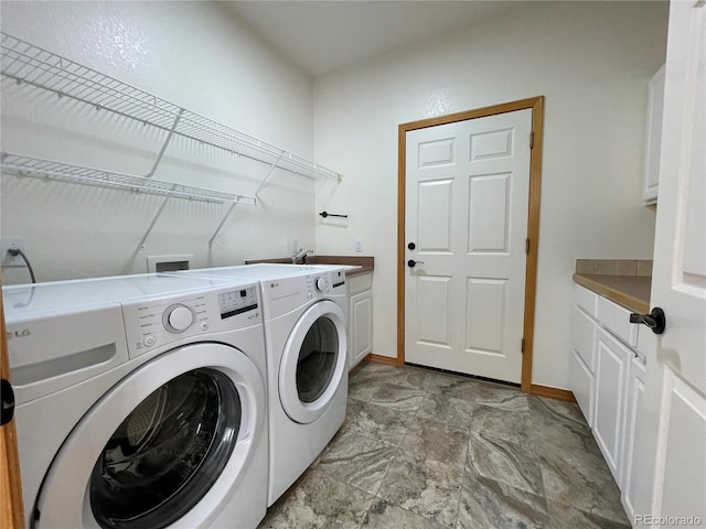 588 Stafford Cir, Castle Rock, CO 80104 - laundry area featuring separate washer and dryer and cabinet space