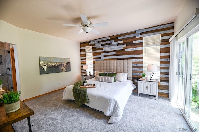 588 Stafford Cir, Castle Rock, CO 80104 - carpeted bedroom with wood walls and a ceiling fan