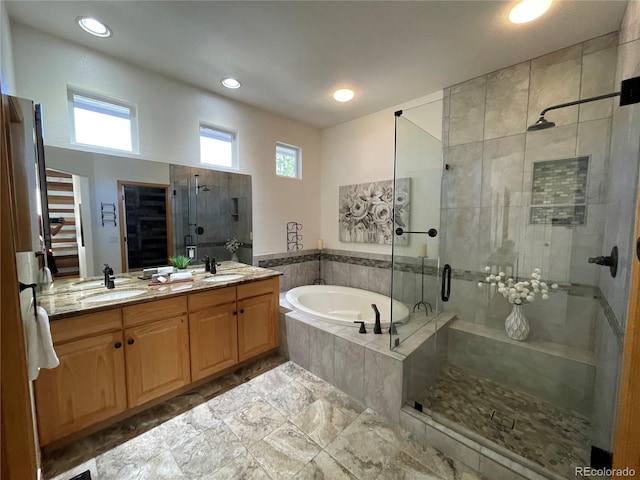 588 Stafford Cir, Castle Rock, CO 80104 - full bath featuring a garden tub, a shower stall, double vanity, and recessed lighting