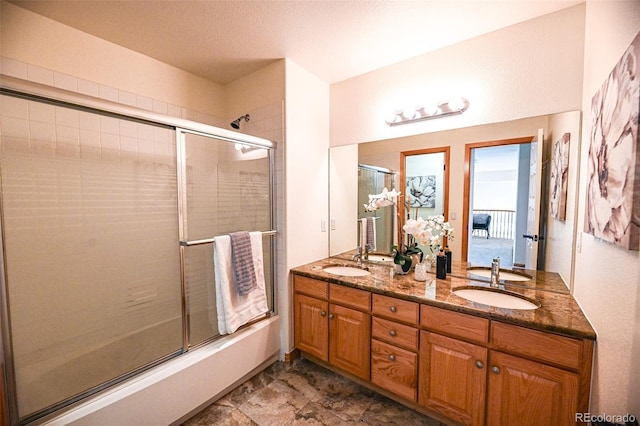 588 Stafford Cir, Castle Rock, CO 80104 - bathroom with shower / bath combination with glass door and double vanity