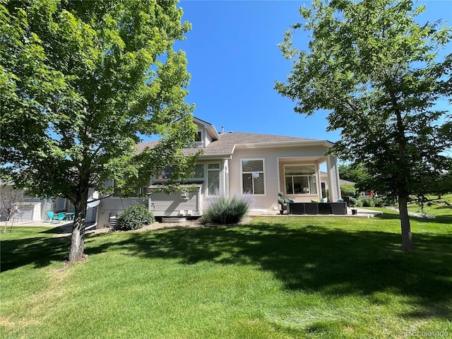 588 Stafford Cir, Castle Rock, CO 80104 - rear view of house featuring outdoor lounge area and a lawn