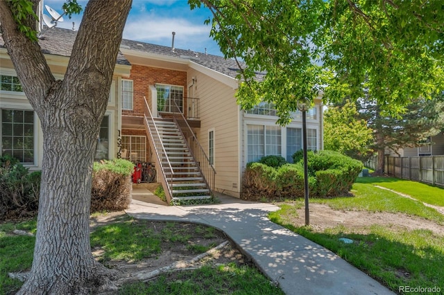 13782 E Lehigh Ave Unit H, Aurora, CO 80014 - view of front of property with stairway and brick siding