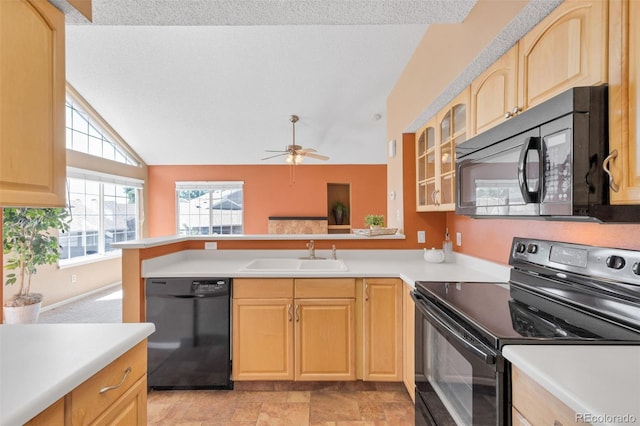 13782 E Lehigh Ave Unit H, Aurora, CO 80014 - kitchen with black appliances, light brown cabinets, vaulted ceiling, glass insert cabinets, and light countertops