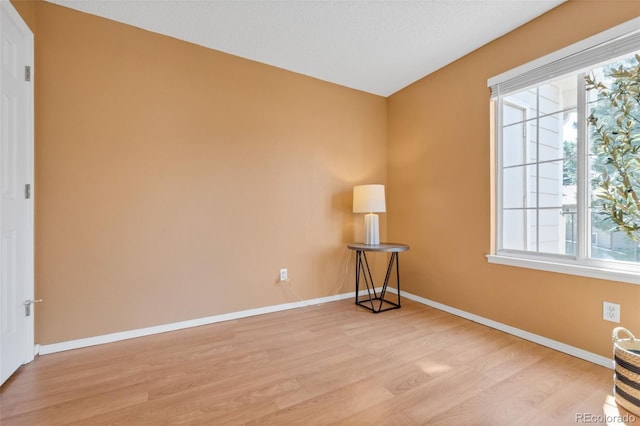 13782 E Lehigh Ave Unit H, Aurora, CO 80014 - spare room with light wood finished floors and baseboards