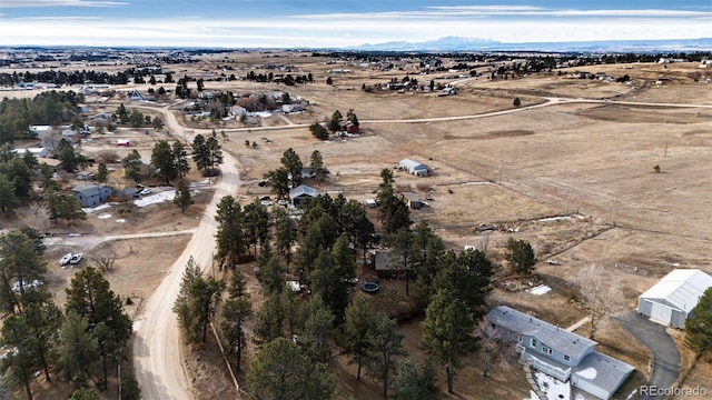 birds eye view of property featuring a rural view and a mountain view