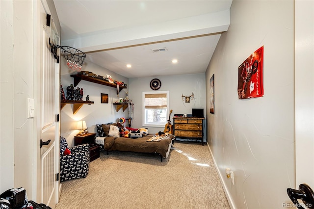 carpeted bedroom with beamed ceiling