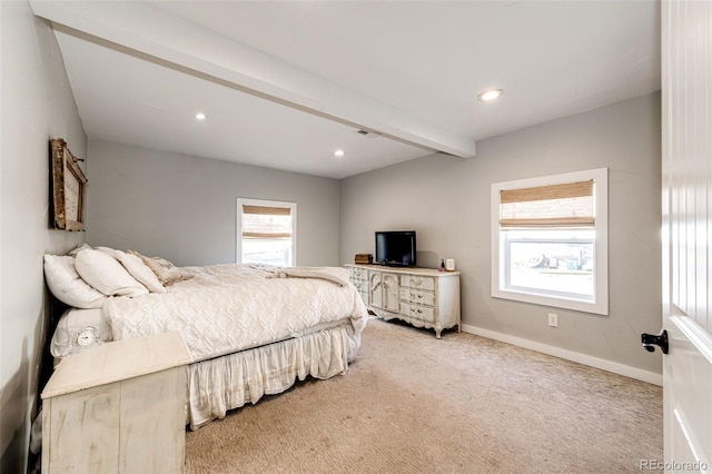 carpeted bedroom featuring beam ceiling