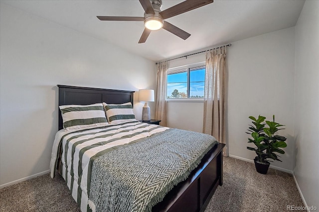 carpeted bedroom featuring ceiling fan and vaulted ceiling