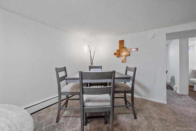 dining room with a baseboard radiator and carpet flooring