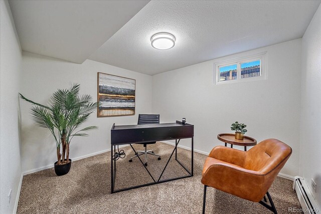 office featuring carpet flooring, a textured ceiling, and baseboard heating