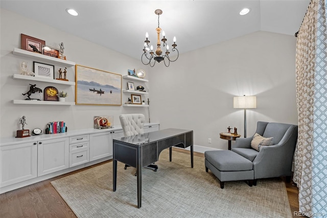 home office featuring recessed lighting, a notable chandelier, and light wood-style floors