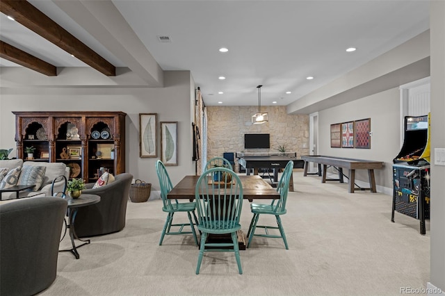 dining area featuring light colored carpet, recessed lighting, baseboards, and a fireplace