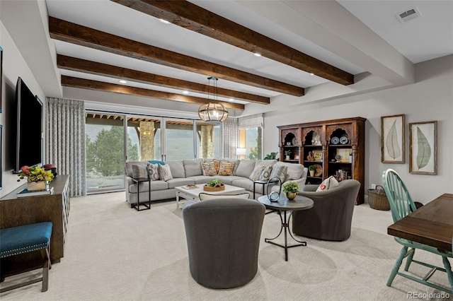 living area with light colored carpet, beam ceiling, and visible vents