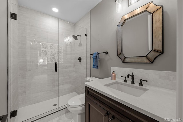 full bath with a stall shower, vanity, toilet, marble finish floor, and recessed lighting