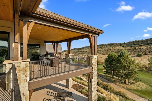 view of patio / terrace featuring a mountain view