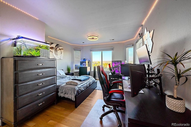 bedroom featuring light wood-type flooring