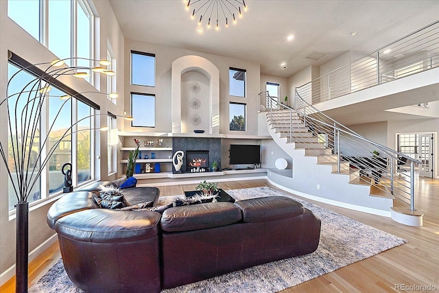 living room featuring wood-type flooring and a healthy amount of sunlight