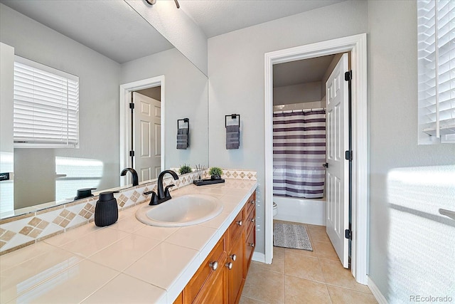 full bathroom featuring toilet, vanity, shower / bath combo, and tile patterned flooring