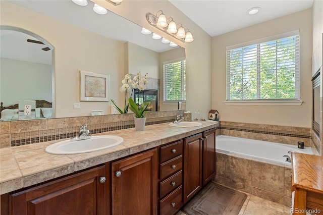 10064 Bluffmont Ct, Lone Tree, CO 80124 - ensuite bathroom featuring double vanity and a bath