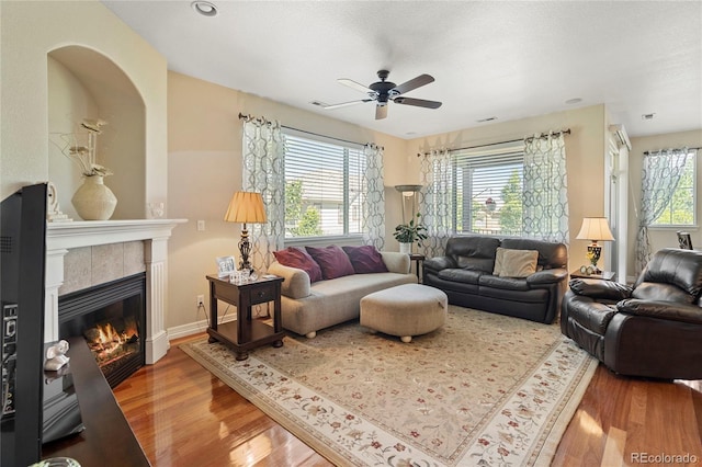 10064 Bluffmont Ct, Lone Tree, CO 80124 - living room with ceiling fan, wood finished floors, and a fireplace