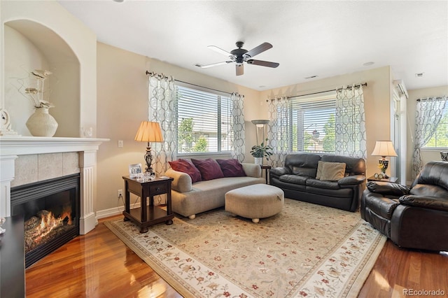 10064 Bluffmont Ct, Lone Tree, CO 80124 - living room with wood finished floors, ceiling fan, and a fireplace