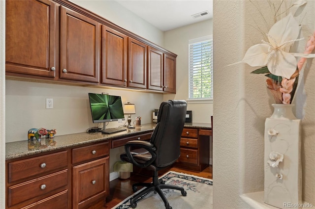 10064 Bluffmont Ct, Lone Tree, CO 80124 - office with built in study area and dark wood finished floors