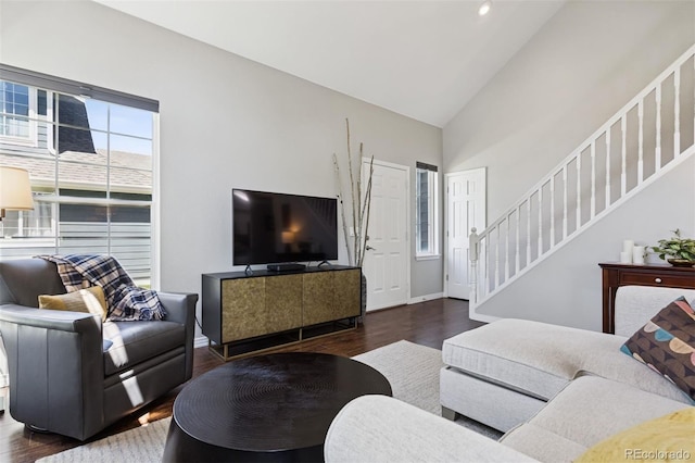 4976 S Nelson St Unit A, Littleton, CO 80127 - living area featuring wood finished floors, stairs, high vaulted ceiling, and baseboards