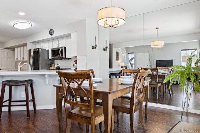 4976 S Nelson St Unit A, Littleton, CO 80127 - dining area with dark wood-style flooring