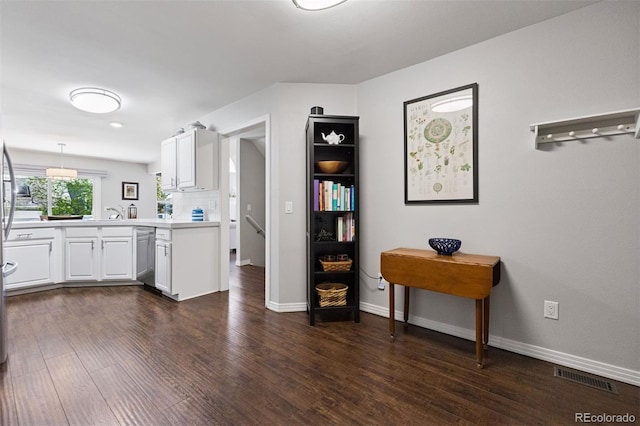4976 S Nelson St Unit A, Littleton, CO 80127 - kitchen featuring dark wood finished floors, white cabinets, and baseboards