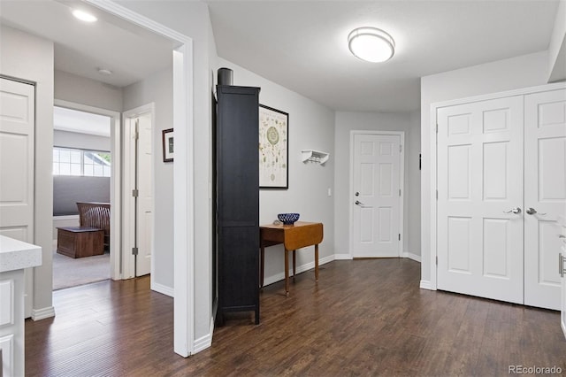 4976 S Nelson St Unit A, Littleton, CO 80127 - hallway featuring dark wood-style floors and baseboards