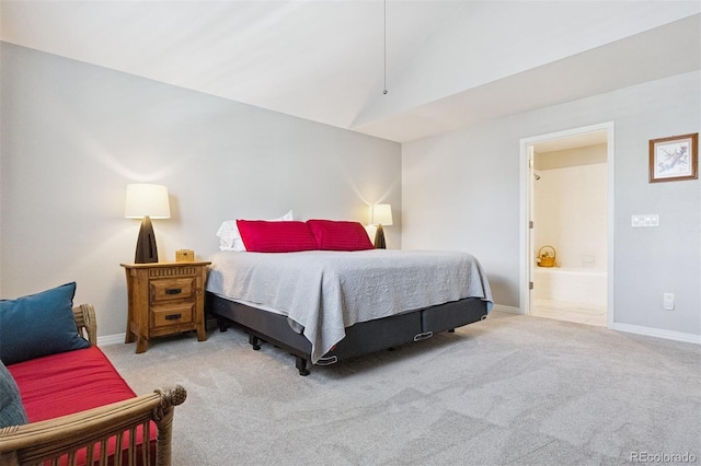 4976 S Nelson St Unit A, Littleton, CO 80127 - carpeted bedroom featuring vaulted ceiling, baseboards, and ensuite bathroom
