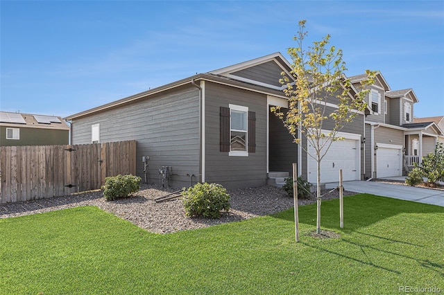 view of front facade with a garage and a front yard