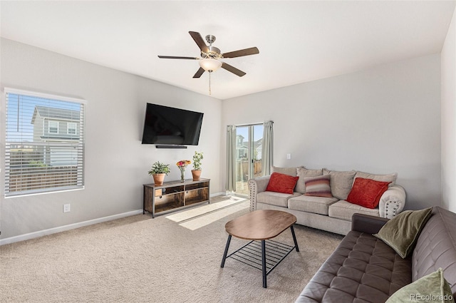 living room featuring carpet, a wealth of natural light, and ceiling fan