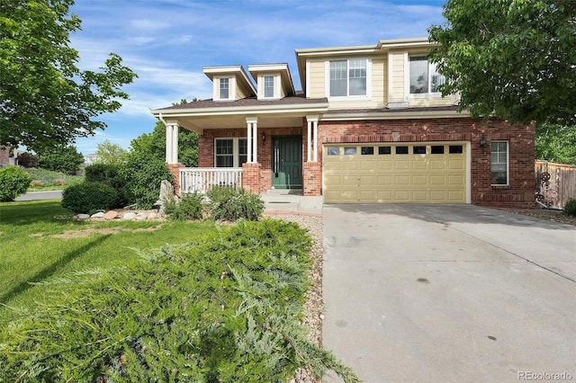 3109 S Jebel Way, Aurora, CO 80013 - view of front of home featuring covered porch, a garage, brick siding, concrete driveway, and a front lawn