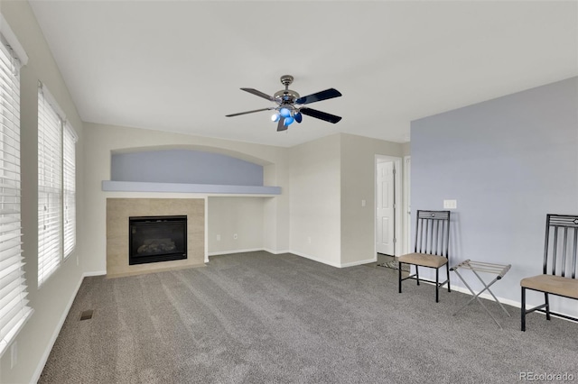 3109 S Jebel Way, Aurora, CO 80013 - unfurnished living room with carpet, a fireplace, ceiling fan, and baseboards