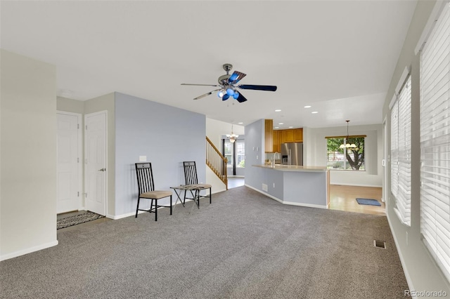 3109 S Jebel Way, Aurora, CO 80013 - living area with a chandelier, light colored carpet, healthy amount of natural light, ceiling fan, and recessed lighting