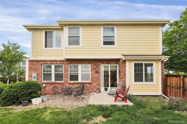 3109 S Jebel Way, Aurora, CO 80013 - rear view of house featuring a patio and brick siding