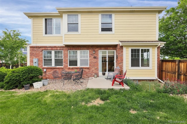 3109 S Jebel Way, Aurora, CO 80013 - rear view of property with a patio area and brick siding