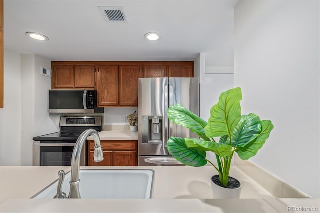 kitchen with appliances with stainless steel finishes and sink