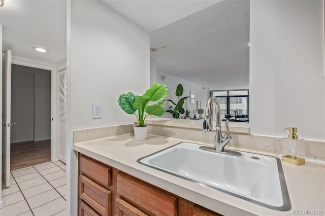 kitchen featuring light tile patterned flooring and sink