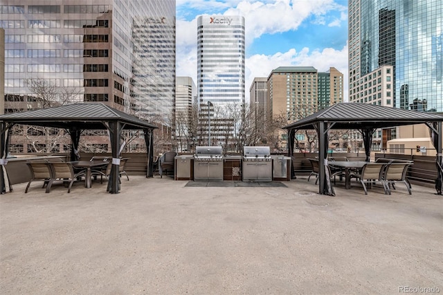 view of patio / terrace with a gazebo, grilling area, and exterior kitchen