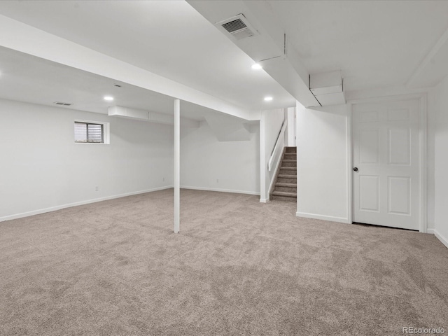 below grade area with recessed lighting, visible vents, carpet flooring, baseboards, and stairs