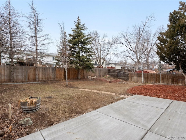 view of yard with a patio area and a fenced backyard