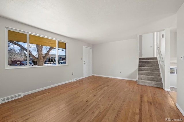 spare room with light wood-type flooring