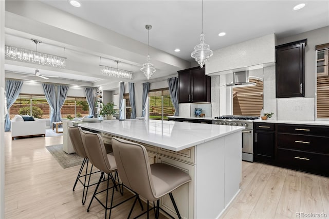1815 Avery Way, Castle Rock, CO 80109 - kitchen with high end range, open floor plan, decorative backsplash, healthy amount of natural light, and recessed lighting