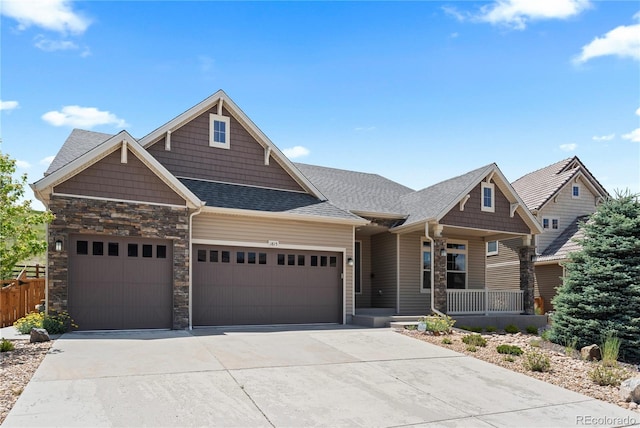 1815 Avery Way, Castle Rock, CO 80109 - craftsman-style home with a garage, stone siding, driveway, and a porch